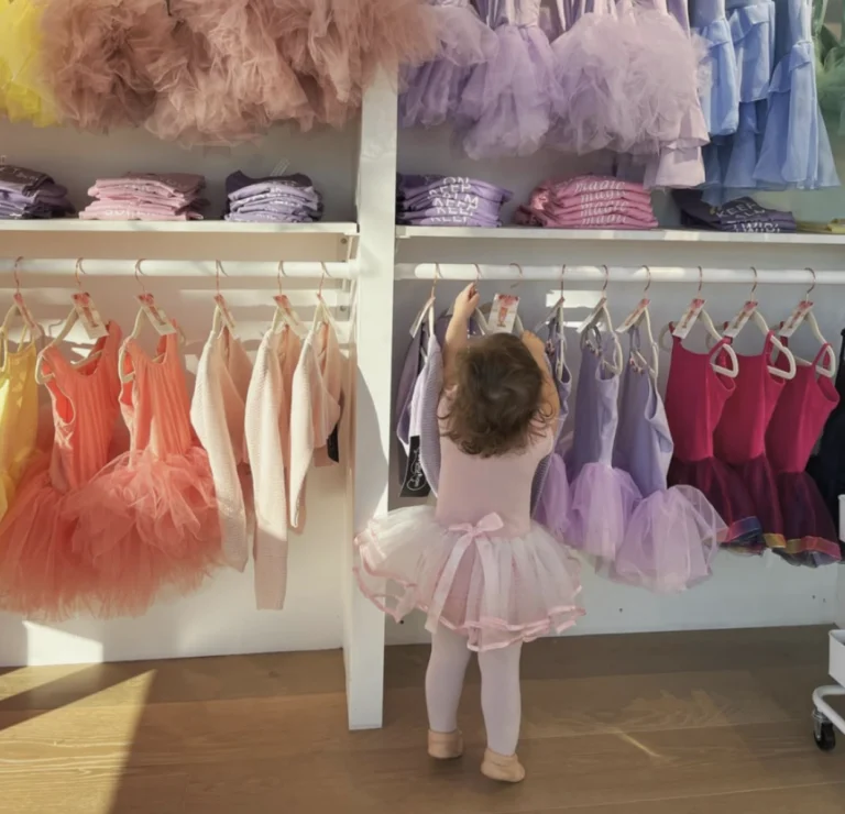 Tiny ballerina picking out tutus at Tutu School Cary Petit Boutique