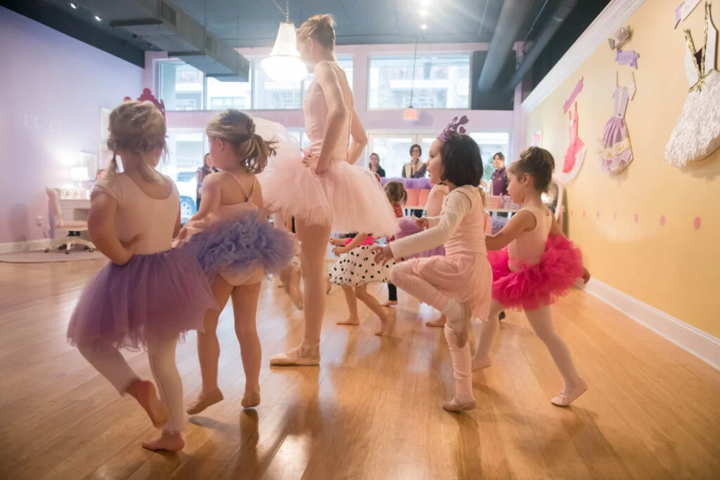 Children marching in ballet class at Tutu School Raleigh with ballerina teacher
