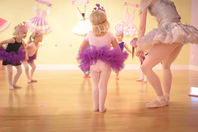 children in tutus doing plies in first ballet class at Tutu School Raleigh
