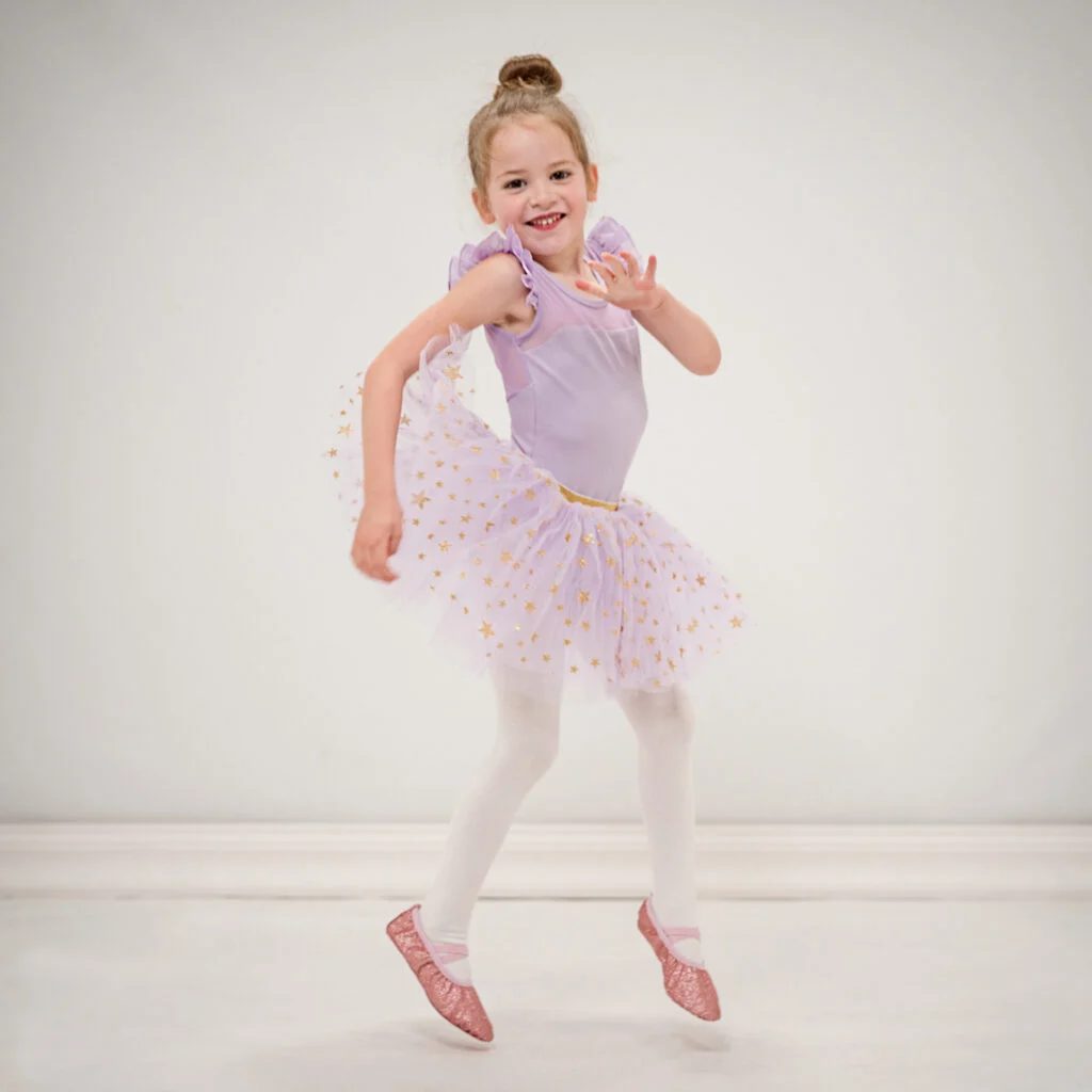 child in leotard, twinkle tutu, and sparkly ballet slippers
