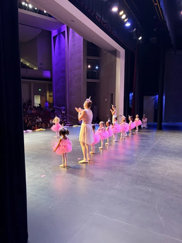 Teachers clapping during solos onstage